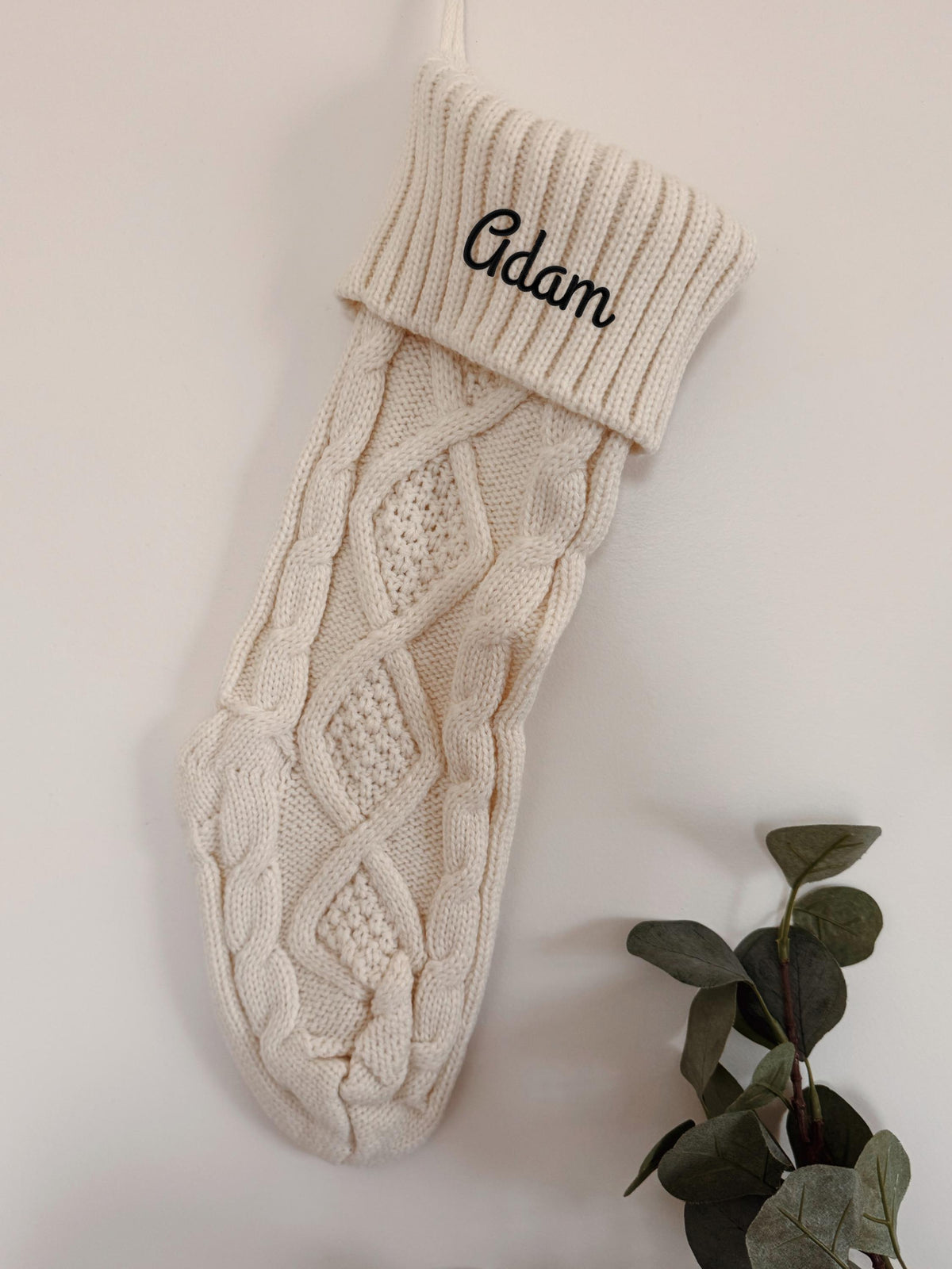 Personalized cable knit Christmas stocking with embroidered name