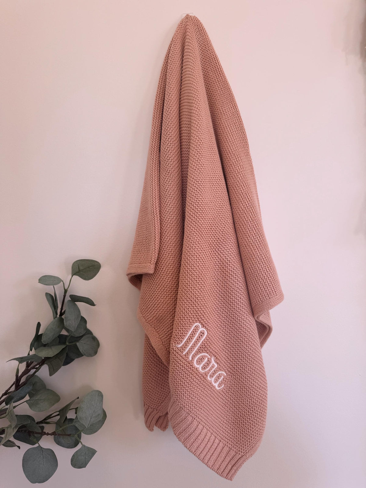 Personalized baby blanket folded and styled