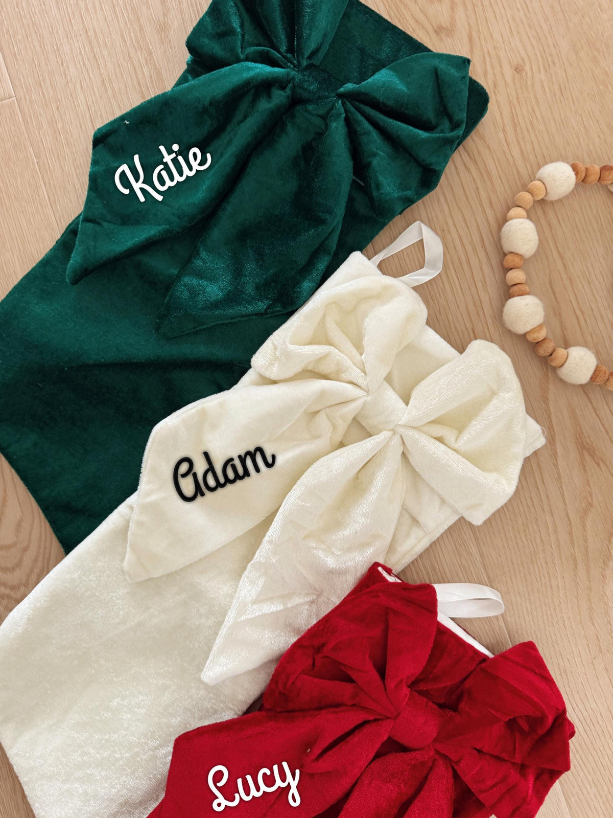 Velvet Christmas stockings in ruby, emerald and ivory